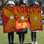 students holding shields